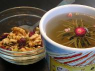 Walnuts, cranberries, sunflower seeds, and pumpkin seeds with flowering tea